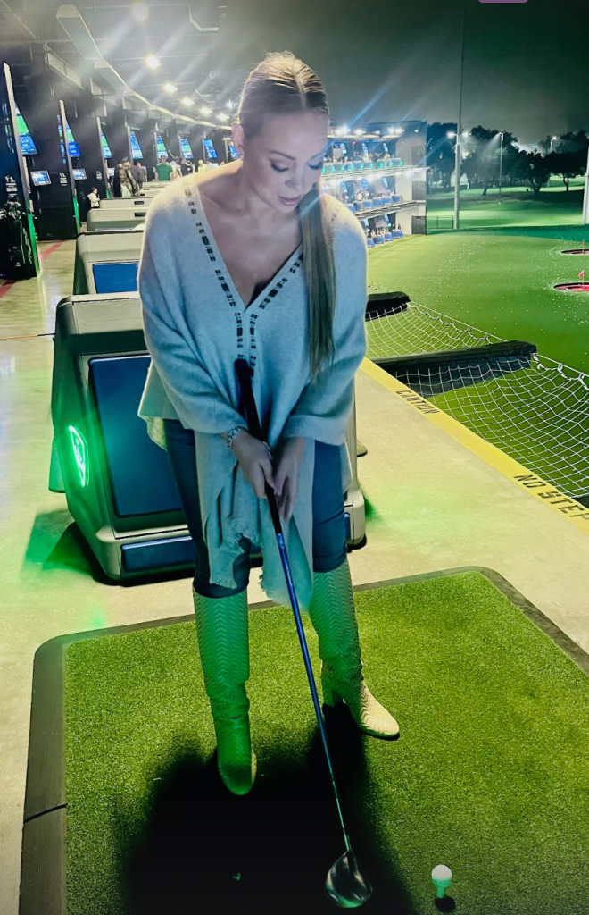 Mariah Carey at mini golf in high heel boots